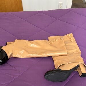 Stylish Tan Knee-High Boots with Black Soles